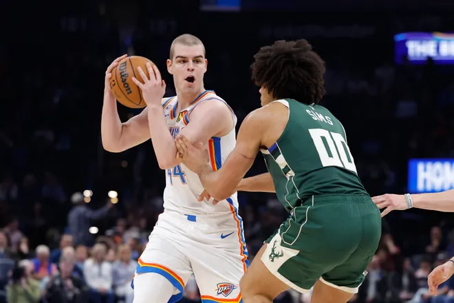 Feb 12, 2026; Oklahoma City, Oklahoma, USA; Oklahoma City Thunder guard Nikola Topić (44) moves the ball against Milwaukee Bucks center Jericho Sims (00) during the second half at Paycom Center. Mandatory Credit: Alonzo Adams-Imagn Images