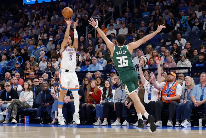Feb 12, 2026; Oklahoma City, Oklahoma, USA; Oklahoma City Thunder guard Jared McCain (3) shoots a three point basket as Milwaukee Bucks forward Pete Nance (35) defends during the second half at Paycom Center. Mandatory Credit: Alonzo Adams-Imagn Images