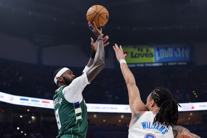 Feb 12, 2026; Oklahoma City, Oklahoma, USA; Milwaukee Bucks forward Bobby Portis (9) shoots a three point basket as Oklahoma City Thunder forward Jaylin Williams (6) defends during the first half at Paycom Center. Mandatory Credit: Alonzo Adams-Imagn Images