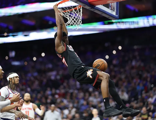 Feb 11, 2026; Philadelphia, Pennsylvania, USA; Philadelphia 76ers guard Vj Edgecombe (77) dunks against the New York Knicks during the second half at Xfinity Mobile Arena.