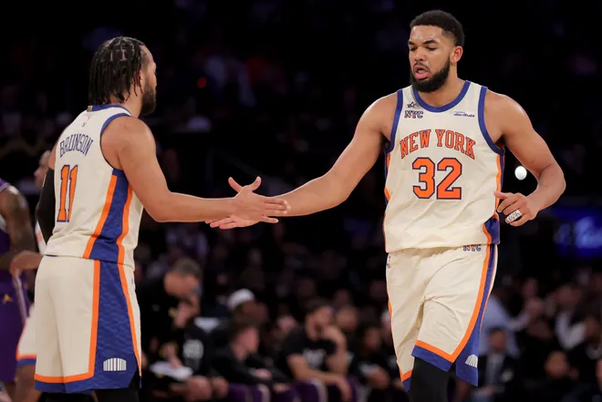 Feb 1, 2026; New York, New York, USA; New York Knicks center Karl-Anthony Towns (32) high fives guard Jalen Brunson (11) during the third quarter against the Los Angeles Lakers at Madison Square Garden. Mandatory Credit: Brad Penner-Imagn Images