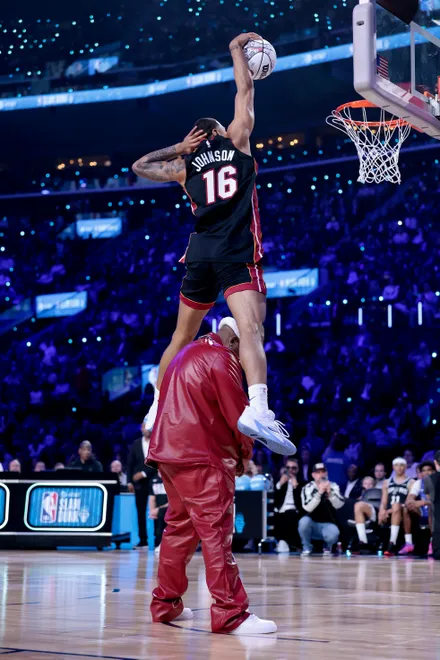 INGLEWOOD, CALIFORNIA - FEBRUARY 14: Keshad Johnson #16 of the Miami Heat jumps over E-40 during the AT&T Slam Dunk Contest during 2026 NBA All-Star Weekend at Intuit Dome on February 14, 2026 in Inglewood, California. NOTE TO USER: User expressly acknowledges and agrees that, by downloading and or using this photograph, User is consenting to the terms and conditions of the GettyImages License Agreement. (Photo by Ronald Martinez/Getty Images)