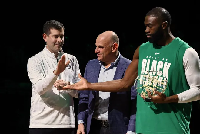 Feb 11, 2026; Boston, Massachusetts, USA; Brad Stevens the president of basketball operations for the Boston Celtics congratulates guard Jaylen Brown (7) for receiving the NBA player of the month award for his performance in the month of January before their game against the Chicago Bulls at TD Garden.