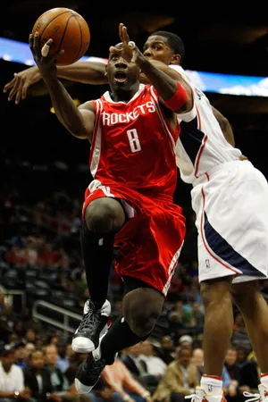 ATLANTA - MARCH 12: Bobby Jackson #8 of the Houston Rockets makes a shot over Joe Johnson #2 of the Atlanta Hawks on March 12, 2008 at the Philips Arena in Atlanta, Georgia. The Rockets defeated the Hawks 83-75 to win their 20th game in a row. NOTE TO USER: User expressly acknowledges and agrees that, by downloading and/or using this Photograph, user is consenting to the terms and conditions of the Getty Images License Agreement. (Photo by Chris Graythen/Getty Images)