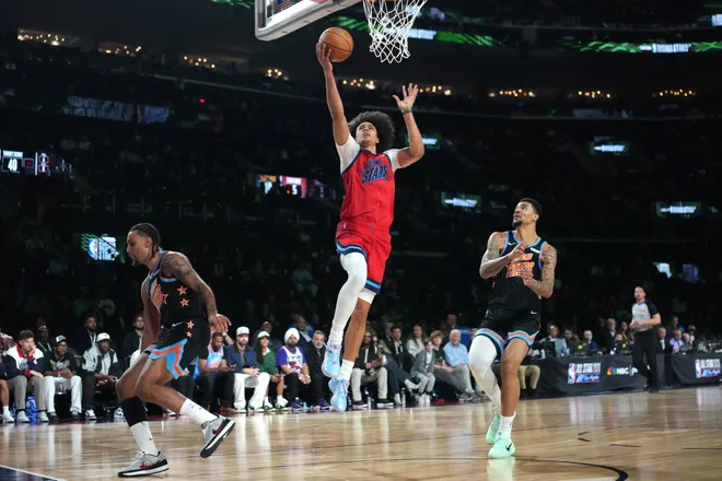 Feb 13, 2026; Inglewood, California, USA; Team Vince frontcourt Kyshawn George (18) of the Washington Wizards shoots during an NBA All Star Rising Stars game at Intuit Dome. Mandatory Credit: Kirby Lee-Imagn Images