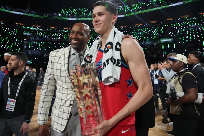 Feb 13, 2026; Inglewood, California, USA; Team Vince guard Egor Demin (8) of the Brooklyn Nets and honorary coach Vince Carter celebrate after defeating Team Melo in an NBA All Star Rising Stars championship game at Intuit Dome. Mandatory Credit: Kirby Lee-Imagn Images