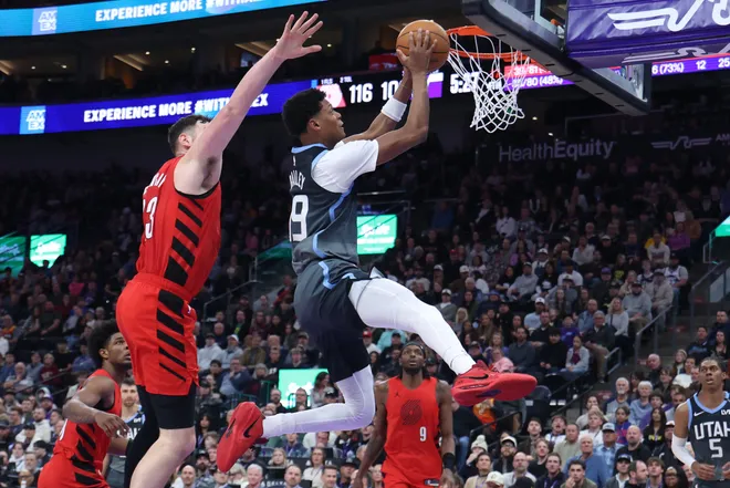 Feb 12, 2026; Salt Lake City, Utah, USA; Utah Jazz guard Ace Bailey (19) shoots against Portland Trail Blazers center Donovan Clingan (23) during the second half at Delta Center. Mandatory Credit: Rob Gray-Imagn Images