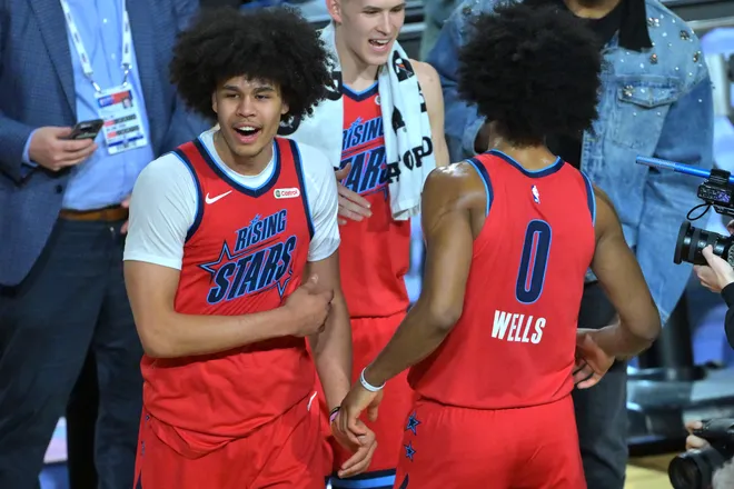 Feb 13, 2026; Inglewood, California, USA; Team Vince frontcourt Kyshawn George (18) of the Washington Wizards and Jaylen Wells (0) of the Memphis Grizzlies react during an NBA All Star Rising Stars championship game at Intuit Dome. Mandatory Credit: Jayne Kamin-Oncea-Imagn Images