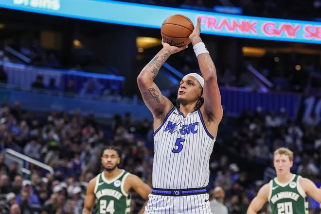 Feb 11, 2026; Orlando, Florida, USA; Orlando Magic forward Paolo Banchero (5) shoots a free throw after a technical foul during the second half against the Milwaukee Bucks at Kia Center. Mandatory Credit: Mike Watters-Imagn Images