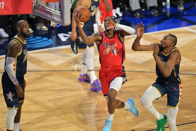 Feb 15, 2026; Inglewood, California, USA; Team USA Stars guard Tyrese Maxey (0) of the Philadelphia 76ers shoots against Team USA Stripes forward Kevin Durant (7) of the Houston Rockets in the championship game during the 75th NBA All Star Game at Intuit Dome. Mandatory Credit: Jayne Kamin-Oncea-Imagn Images