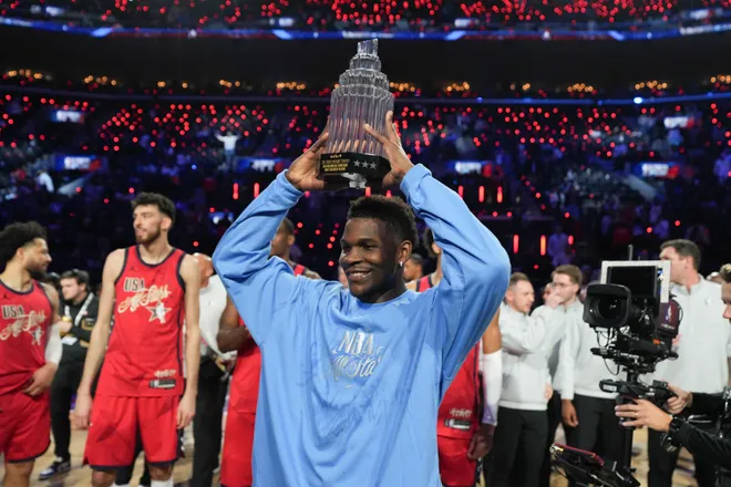 Feb 15, 2026; Inglewood, California, USA; Team USA Stars guard Anthony Edwards (5) of the Minnesota Timberwolves poses with the MVP trophy after the 75th NBA All Star Game at Intuit Dome. Mandatory Credit: Kirby Lee-Imagn Images