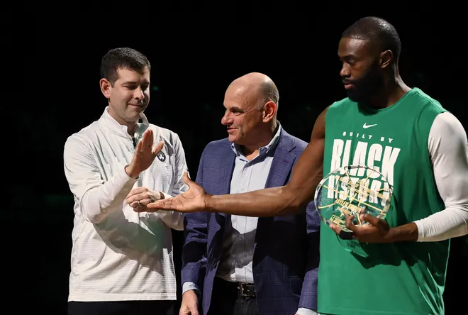 Feb 11, 2026; Boston, Massachusetts, USA; Brad Stevens the president of basketball operations for the Boston Celtics congratulates guard Jaylen Brown (7) for receiving the NBA player of the month award for his performance in the month of January before their game against the Chicago Bulls at TD Garden. Mandatory Credit: Winslow Townson-Imagn Images