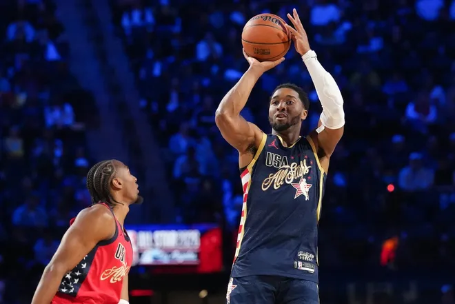 Feb 15, 2026; Inglewood, California, USA; Team USA Stripes guard Donovan Mitchell (45) of the Cleveland Cavaliers shoots in game four against Team Stars during the 75th NBA All Star Game at Intuit Dome.