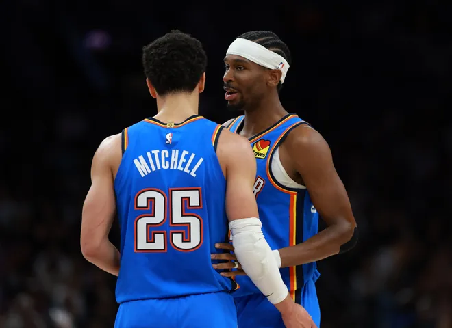 Jan 4, 2026; Phoenix, Arizona, USA; Oklahoma City Thunder guard Shai Gilgeous-Alexander (2) with guard Ajay Mitchell (25) against the Phoenix Suns at Mortgage Matchup Center. Mandatory Credit: Mark J. Rebilas-Imagn Images