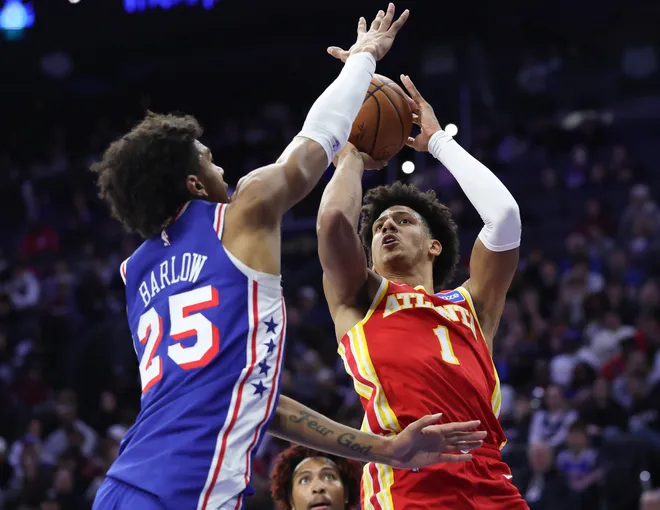 Feb 19, 2026; Philadelphia, Pennsylvania, USA; Atlanta Hawks forward Jalen Johnson (1) shoots in front of Philadelphia 76ers forward Dominick Barlow (25) during the second quarter at Xfinity Mobile Arena. Mandatory Credit: Bill Streicher-Imagn Images