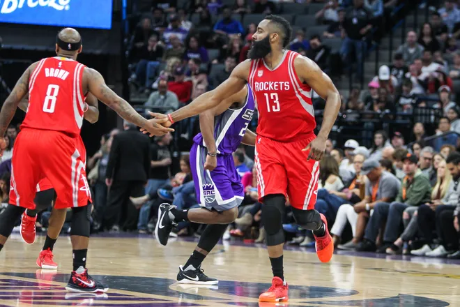 Apr 9, 2017; Sacramento, CA, USA; Houston Rockets guard James Harden (13) celebrates with guard Bobby Brown (8) during the third quarter against the Sacramento Kings at Golden 1 Center. The Rockets defeated the Kings 135-128. Mandatory Credit: Sergio Estrada-USA TODAY Sports