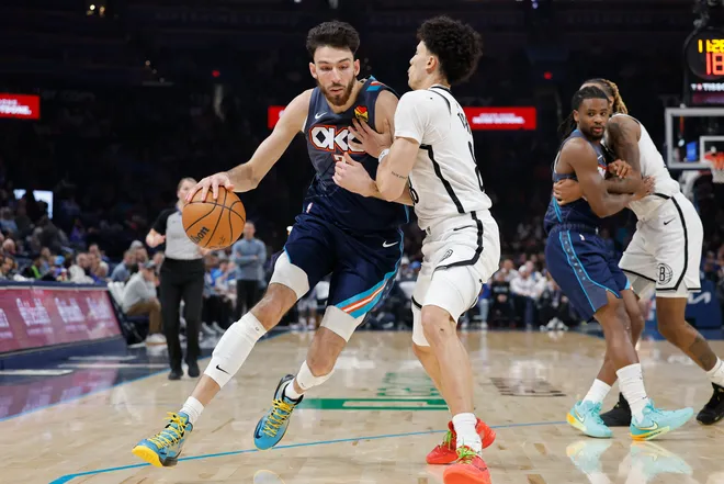 Feb 20, 2026; Oklahoma City, Oklahoma, USA; Oklahoma City Thunder center/forward Chet Holmgren (7) drives down the court against Brooklyn Nets guard Nolan Traore (88) during the second half at Paycom Center. Mandatory Credit: Alonzo Adams-Imagn Images
