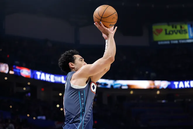 Feb 20, 2026; Oklahoma City, Oklahoma, USA; Oklahoma City Thunder guard Jared McCain (3) shoots a three point basket against the Brooklyn Nets during the second half at Paycom Center. Mandatory Credit: Alonzo Adams-Imagn Images