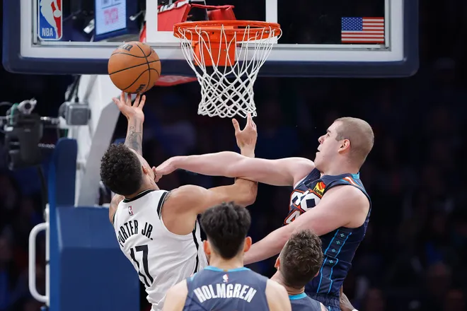 Feb 20, 2026; Oklahoma City, Oklahoma, USA; Oklahoma City Thunder guard Nikola Topić (44) fouls Brooklyn Nets forward Michael Porter Jr. (17) during the second half at Paycom Center. Mandatory Credit: Alonzo Adams-Imagn Images