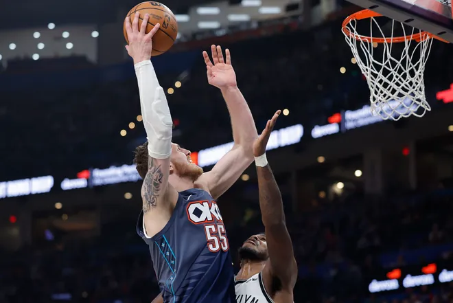 Feb 20, 2026; Oklahoma City, Oklahoma, USA; Oklahoma City Thunder center/forward Isaiah Hartenstein (55) shoots as Brooklyn Nets guard Nolan Traore (88) defends during the second half at Paycom Center. Mandatory Credit: Alonzo Adams-Imagn Images