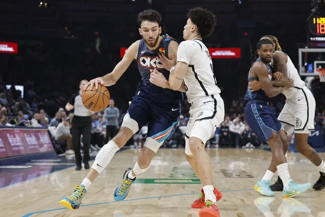 Feb 20, 2026; Oklahoma City, Oklahoma, USA; Oklahoma City Thunder center/forward Chet Holmgren (7) drives down the court against Brooklyn Nets guard Nolan Traore (88) during the second half at Paycom Center.