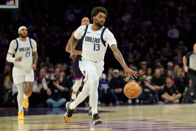 Feb 20, 2026; Minneapolis, Minnesota, USA; Dallas Mavericks forward Naji Marshall (13) dribbles against the Minnesota Timberwolves in the first quarter at Target Center.