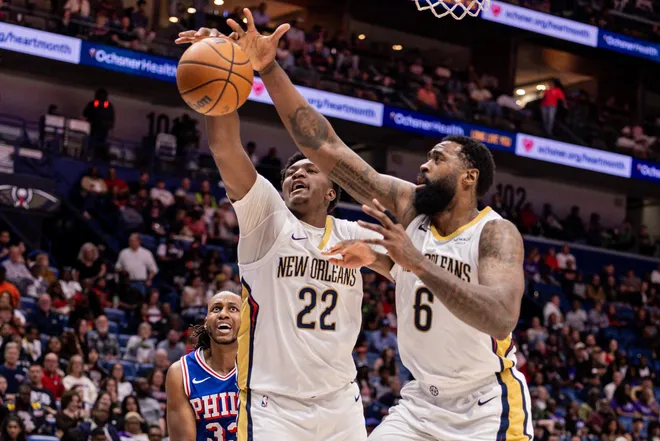 Feb 21, 2026; New Orleans, Louisiana, USA; New Orleans Pelicans center Derik Queen (22) and center DeAndre Jordan (6) go for a loose ball against Philadelphia 76ers forward Jabari Walker (33) during the first half at Smoothie King Center. Mandatory Credit: Stephen Lew-Imagn Images
