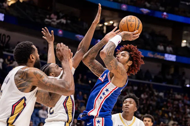 Feb 21, 2026; New Orleans, Louisiana, USA; Philadelphia 76ers guard Kelly Oubre Jr. (9) shoots a jump shot over New Orleans Pelicans forward Herbert Jones (2) during the first half at Smoothie King Center. Mandatory Credit: Stephen Lew-Imagn Images