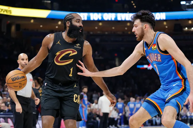 Feb 22, 2026; Oklahoma City, Oklahoma, USA; Cleveland Cavaliers guard James Harden (1) moves the ball as Oklahoma City Thunder center/forward Chet Holmgren (7) defends during the second half at Paycom Center. Mandatory Credit: Alonzo Adams-Imagn Images