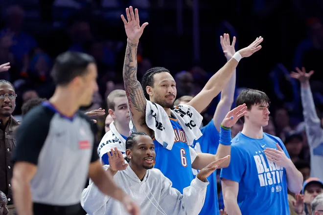 Feb 22, 2026; Oklahoma City, Oklahoma, USA; Oklahoma City Thunder guard Shai Gilgeous-Alexander (2), forward Jaylin Williams (6) and the Thunder bench celebrate after watching their team score against the Cleveland Cavaliers during the second half at Paycom Center. Mandatory Credit: Alonzo Adams-Imagn Images