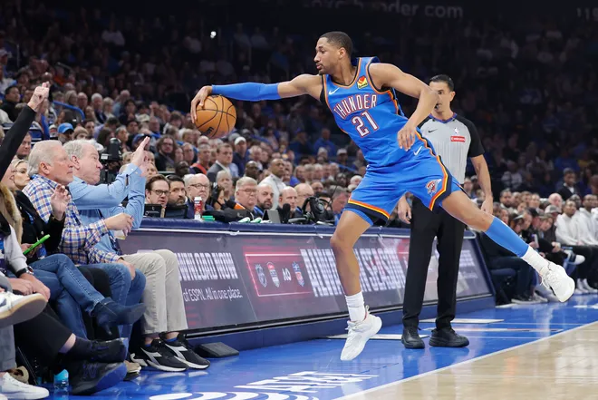 Feb 22, 2026; Oklahoma City, Oklahoma, USA; Oklahoma City Thunder guard Aaron Wiggins (21) reaches to save the ball from going out of bounds during a play against the Cleveland Cavaliers during the first half at Paycom Center. Mandatory Credit: Alonzo Adams-Imagn Images