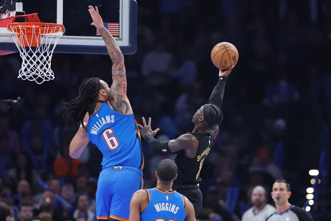 Feb 22, 2026; Oklahoma City, Oklahoma, USA; Cleveland Cavaliers guard Dennis Schroder (8) goes up for a basket against Oklahoma City Thunder forward Jaylin Williams (6) during the first quarter at Paycom Center. Mandatory Credit: Alonzo Adams-Imagn Images