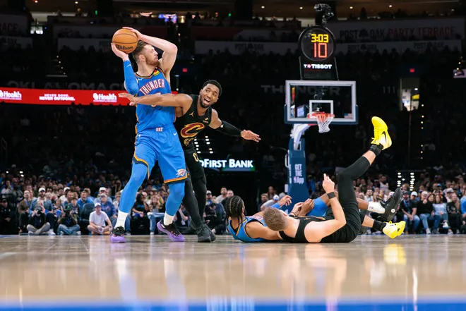 OKLAHOMA CITY, OKLAHOMA - FEBRUARY 22: Isaiah Hartenstein #55 of the Oklahoma City Thunder protects the ball from Donovan Mitchell #45 of the Cleveland Cavaliers during the second half at Paycom Center on February 22, 2026 in Oklahoma City, Oklahoma. NOTE TO USER: User expressly acknowledges and agrees that, by downloading and or using this photograph, User is consenting to the terms and conditions of the Getty Images License Agreement. (Photo by William Purnell/Getty Images)
