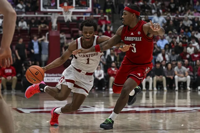 Jan 2, 2025; Stanford, California, USA; Stanford Cardinal guard Ebuka Okorie (1) dribbles against Louisville Cardinals guard Ryan Conwell (3) during the second half at Maples Pavilion.
