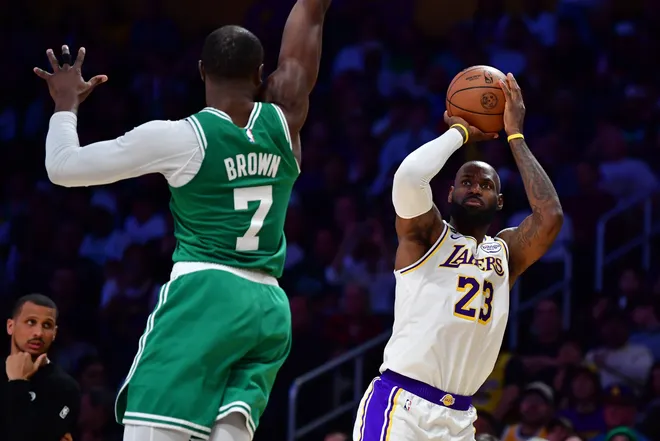 Feb 22, 2026; Los Angeles, California, USA; Los Angeles Lakers forward LeBron James (23) shoots against Boston Celtics guard Jaylen Brown (7) during the second half at Crypto.com Arena. Mandatory Credit: Gary A. Vasquez-Imagn Images