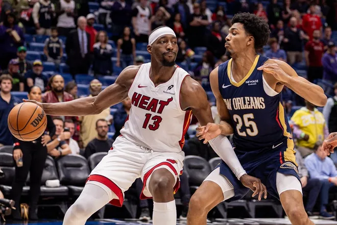 Feb 11, 2026; New Orleans, Louisiana, USA; Miami Heat center/forward Bam Adebayo (13) dribbles against New Orleans Pelicans forward Trey Murphy III (25) during the first half at Smoothie King Center.