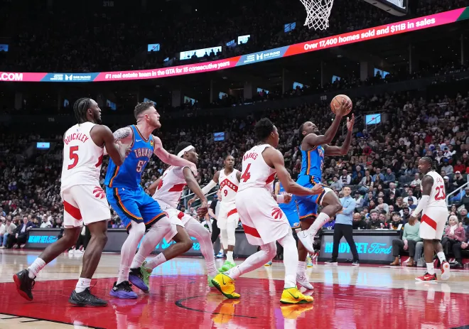 Feb 24, 2026; Toronto, Ontario, CAN; Oklahoma City Thunder guard Cason Wallace (22) drives to the basket against Toronto Raptors forward Scottie Barnes (4) during the fourth quarter at Scotiabank Arena. Mandatory Credit: Nick Turchiaro-Imagn Images