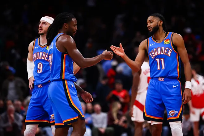 TORONTO, CANADA - FEBRUARY 24: Cason Wallace #22 and Isaiah Joe #11 of the Oklahoma City Thunder celebrate at the end of their NBA game against the Toronto Raptors at Scotiabank Arena on February 24, 2026 in Toronto, Ontario, Canada. NOTE TO USER: User expressly acknowledges and agrees that, by downloading and or using this photograph, User is consenting to the terms and conditions of the Getty Images License Agreement. (Photo by Cole Burston/Getty Images)