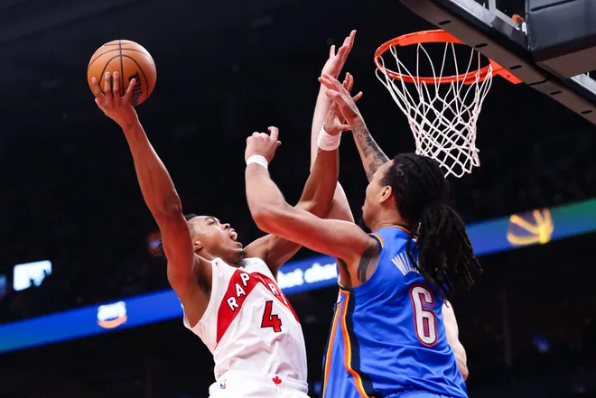 TORONTO, CANADA - FEBRUARY 24: Scottie Barnes #4 of the Toronto Raptors drives to the net against Jaylin Williams #6 of the Oklahoma City Thunder during the first half of their NBA game at Scotiabank Arena on February 24, 2026 in Toronto, Ontario, Canada. NOTE TO USER: User expressly acknowledges and agrees that, by downloading and or using this photograph, User is consenting to the terms and conditions of the Getty Images License Agreement. (Photo by Cole Burston/Getty Images)