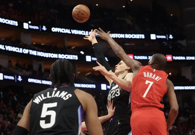 Feb 23, 2026; Houston, Texas, USA; Utah Jazz forward Lauri Markkanen (23) shoots against Houston Rockets forward Kevin Durant (7) in the first quarter at Toyota Center.