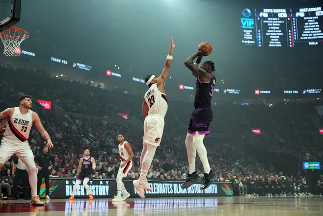 Feb 24, 2026; Portland, Oregon, USA; Minnesota Timberwolves forward Julius Randle (30) shoots over Portland Trail Blazers forward Toumani Camara (33) during the first half at Moda Center.