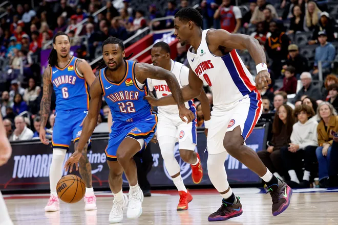 Feb 25, 2026; Detroit, Michigan, USA; Oklahoma City Thunder guard Cason Wallace (22) dribbles defended by Detroit Pistons center Jalen Duren (0) in the second half at Little Caesars Arena. Mandatory Credit: Rick Osentoski-Imagn Images