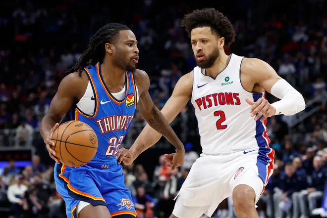 Feb 25, 2026; Detroit, Michigan, USA; Oklahoma City Thunder guard Cason Wallace (22) dribbles defended by Detroit Pistons guard Cade Cunningham (2) in the second half at Little Caesars Arena. Mandatory Credit: Rick Osentoski-Imagn Images
