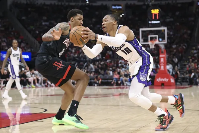 Feb 25, 2026; Houston, Texas, USA; Sacramento Kings guard Russell Westbrook (18) drives with the ball as Houston Rockets forward Jabari Smith Jr. (10) defends during the third quarter at Toyota Center.
