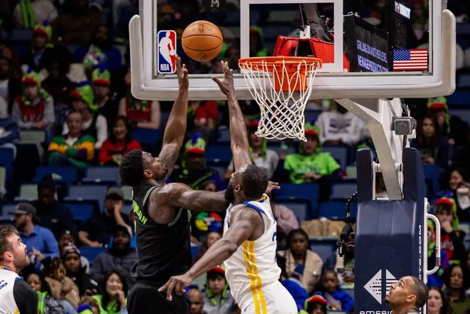 Feb 24, 2026; New Orleans, Louisiana, USA; New Orleans Pelicans forward Zion Williamson (1) drives to the basket against Golden State Warriors forward Draymond Green (23) during the second half at Smoothie King Center.