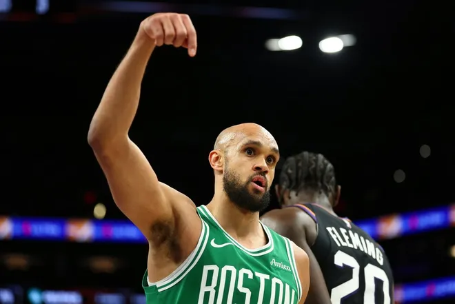 Feb 24, 2026; Phoenix, Arizona, USA; Boston Celtics guard Derrick White celebrates against the Phoenix Suns in the second half at Mortgage Matchup Center.