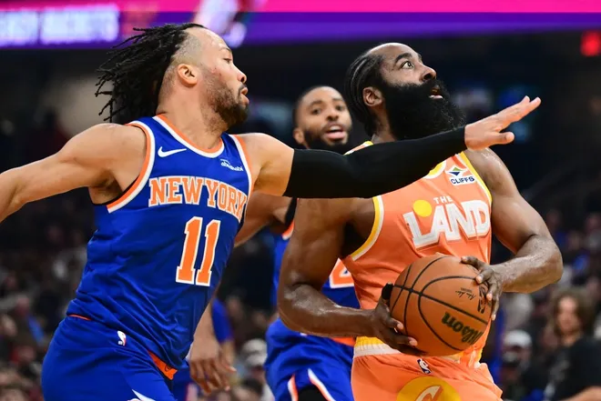 Feb 24, 2026; Cleveland, Ohio, USA; Cleveland Cavaliers guard James Harden (1) drives to the basket against New York Knicks guard Jalen Brunson (11) during the second half at Rocket Arena.
