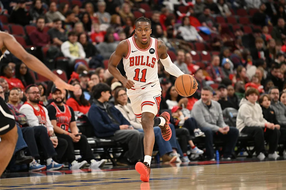 Jan 18, 2026; Chicago, Illinois, USA; Chicago Bulls guard Ayo Dosunmu (11) dribbles against the Brooklyn Nets during the first half at United Center. Mandatory Credit: Patrick Gorski-Imagn Images
