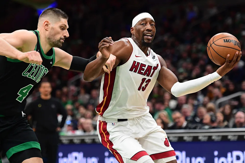 Feb 6, 2026; Boston, Massachusetts, USA; Boston Celtics center Nikola Vucevic defends Miami Heat center Bam Adebayo (13) during the first half at TD Garden. Mandatory Credit: Bob DeChiara-Imagn Images