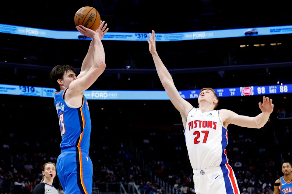 Feb 25, 2026; Detroit, Michigan, USA; Oklahoma City Thunder forward Brooks Barnhizer (23) shoots on Detroit Pistons guard Kevin Huerter (27) in the second half at Little Caesars Arena. Mandatory Credit: Rick Osentoski-Imagn Images